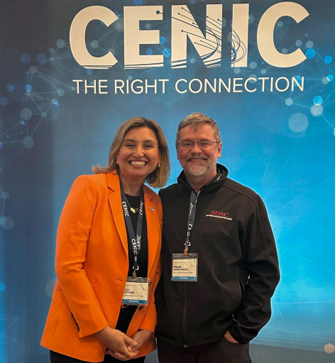 Frank Würthwein and Ilkay Altintas standing in front of a CENIC backdrop at a conference.